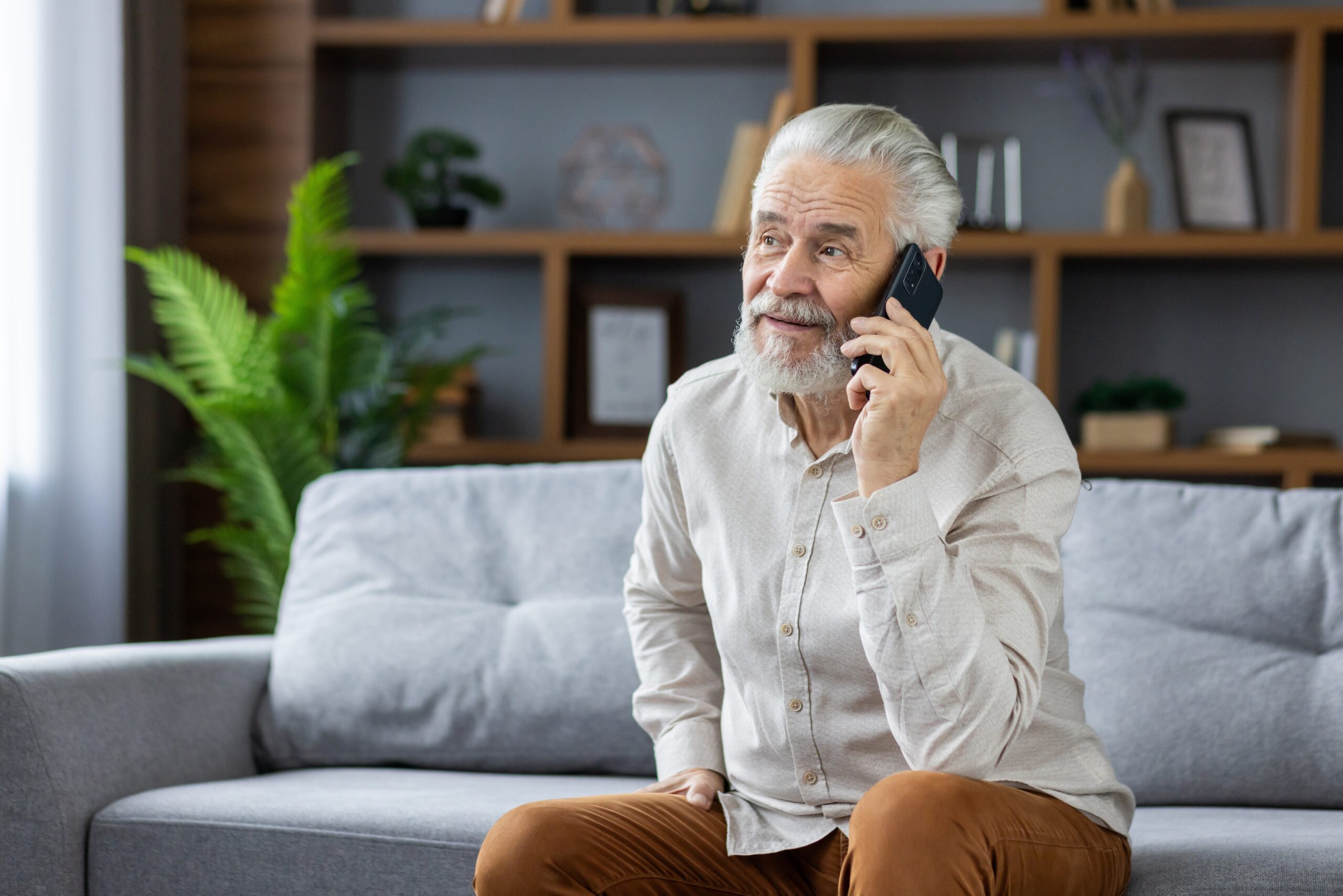 A gray haired senior man.